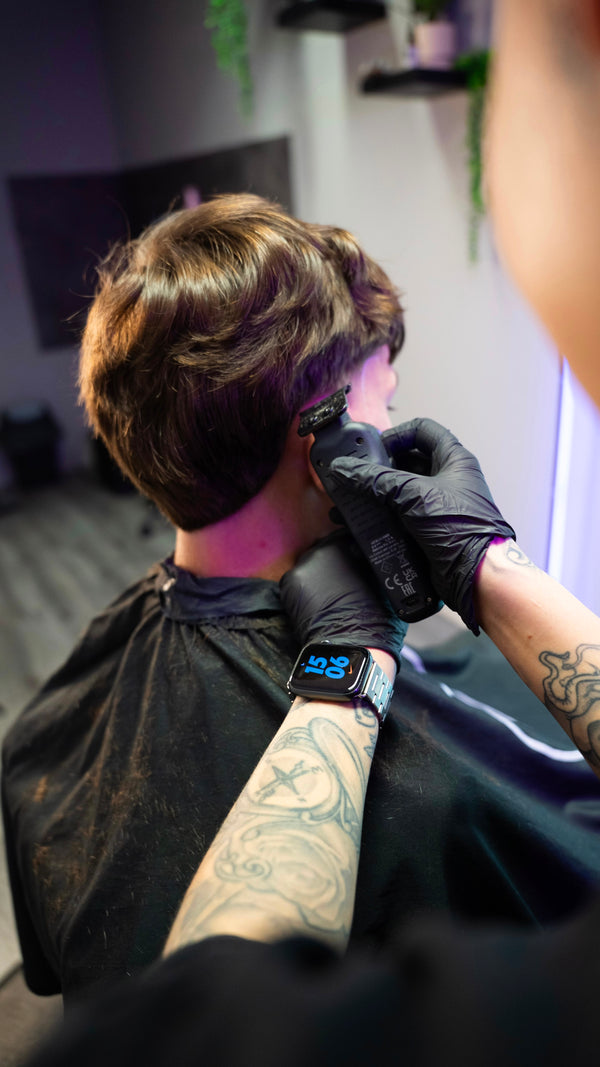 TJ Wolf Cutss barber, mirror reflection